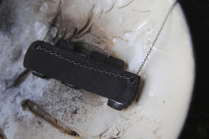 Pieces of the Tide / Black Ceramic Necklace with Seashell Iprints