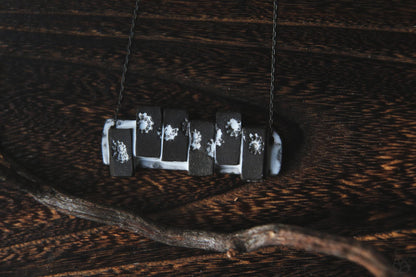 Pieces of the Tide / Black Ceramic Necklace with Seashell Iprints