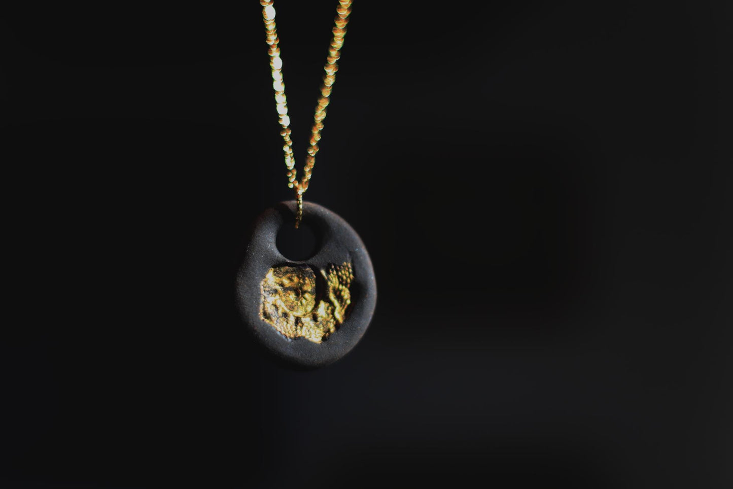 Golden Pebble / Black Ceramic Pendant with Seashell Imprint