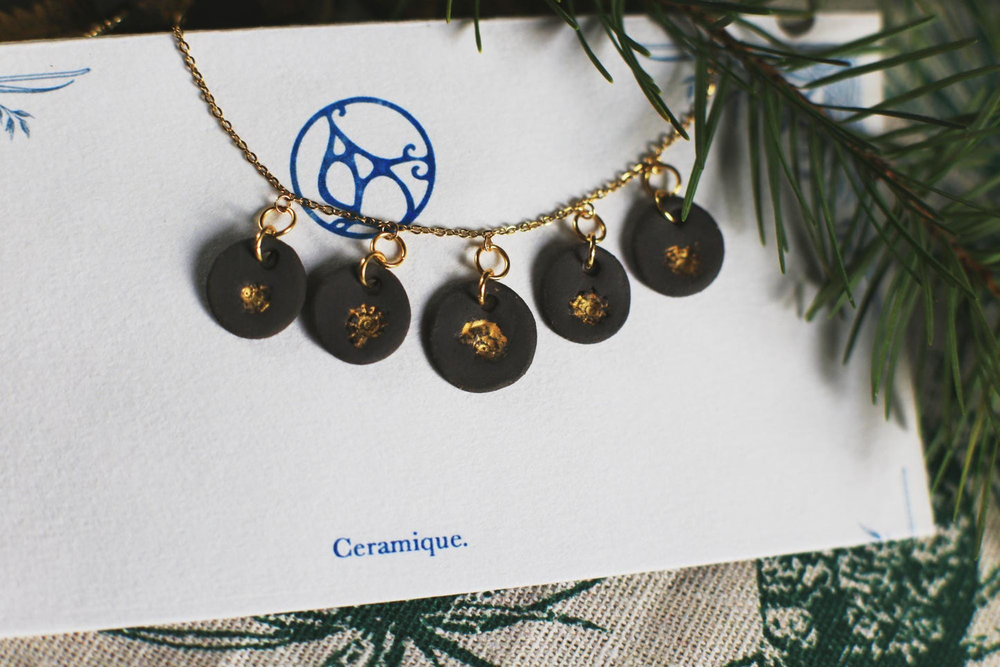 Golden Coast Charms / Black Ceramics Necklace with Seashell Imprints