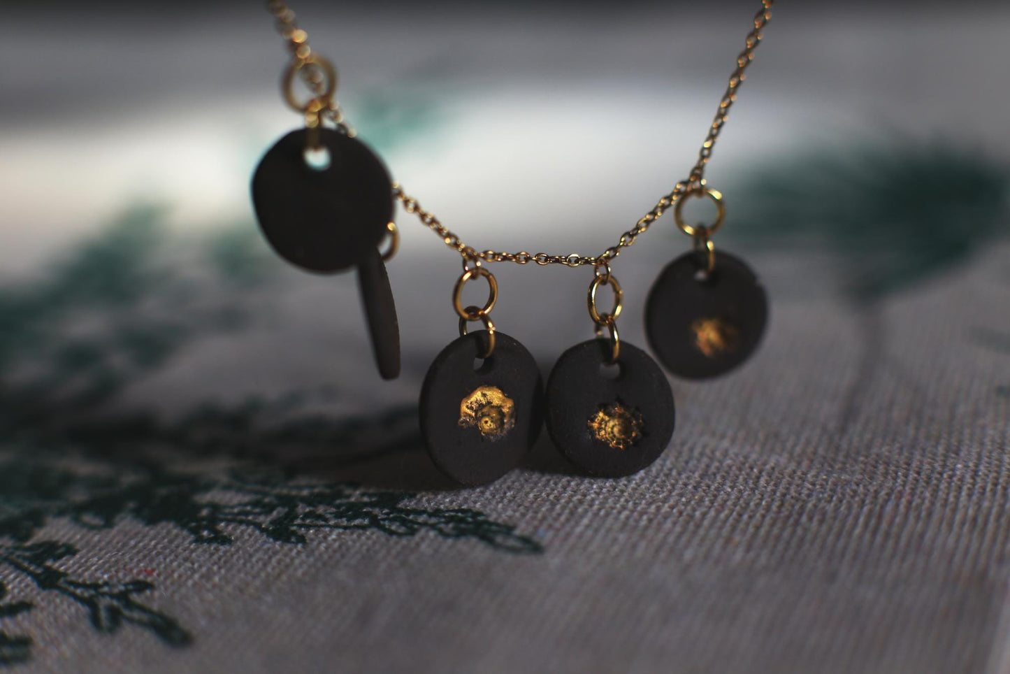 Golden Coast Charms / Black Ceramics Necklace with Seashell Imprints