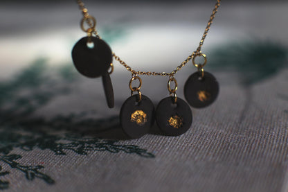 Golden Coast Charms / Black Ceramics Necklace with Seashell Imprints