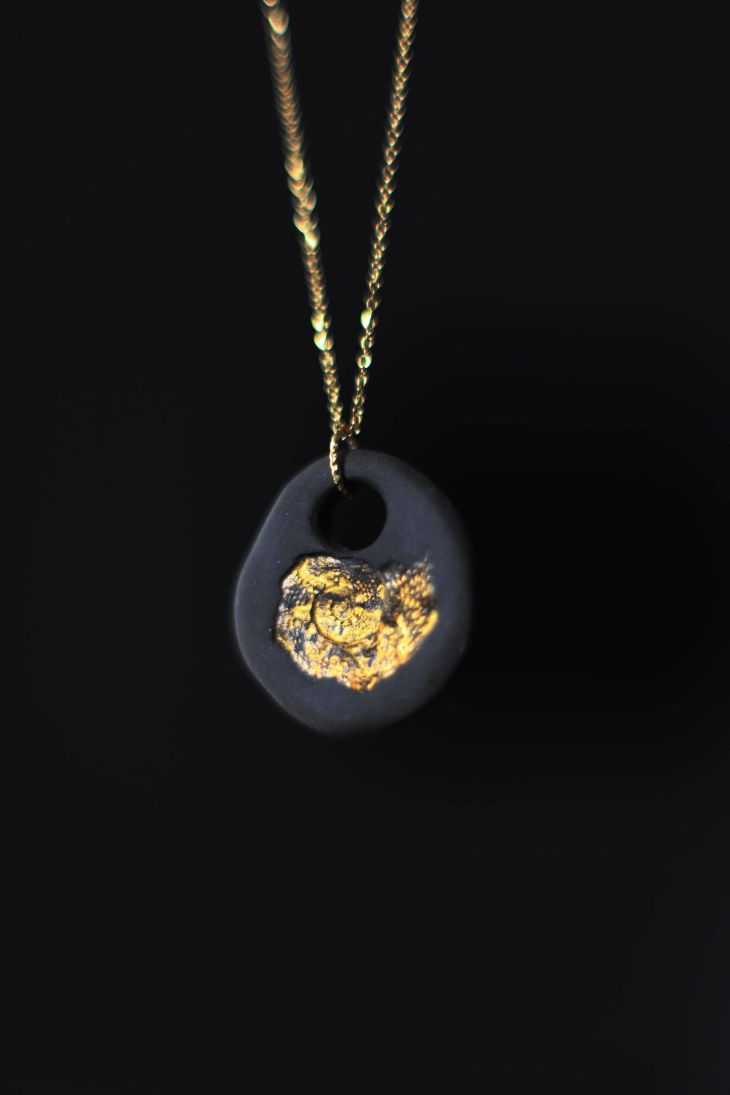 Golden Pebble / Black Ceramic Pendant with Seashell Imprint