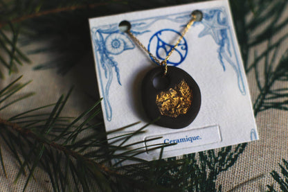 Golden Pebble / Black Ceramic Pendant with Seashell Imprint