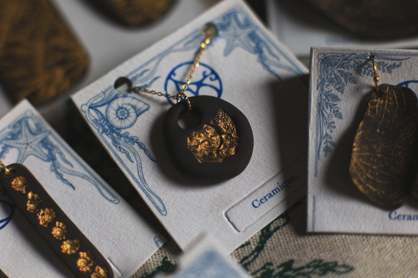 Golden Pebble / Black Ceramic Pendant with Seashell Imprint