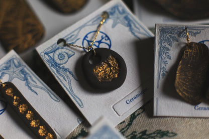 Golden Pebble / Black Ceramic Pendant with Seashell Imprint
