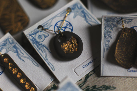 Golden Pebble / Black Ceramic Pendant with Seashell Imprint